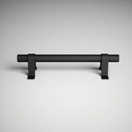 The 13th Street Barn Door Handle, a sleek matte black horizontal bar, is mounted on two U-shaped brackets against a light gray background.