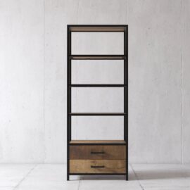 An Opus 25" Bookshelf with a black metal frame, four wooden shelves, and two wooden drawers at the bottom, set against a plain white wall.