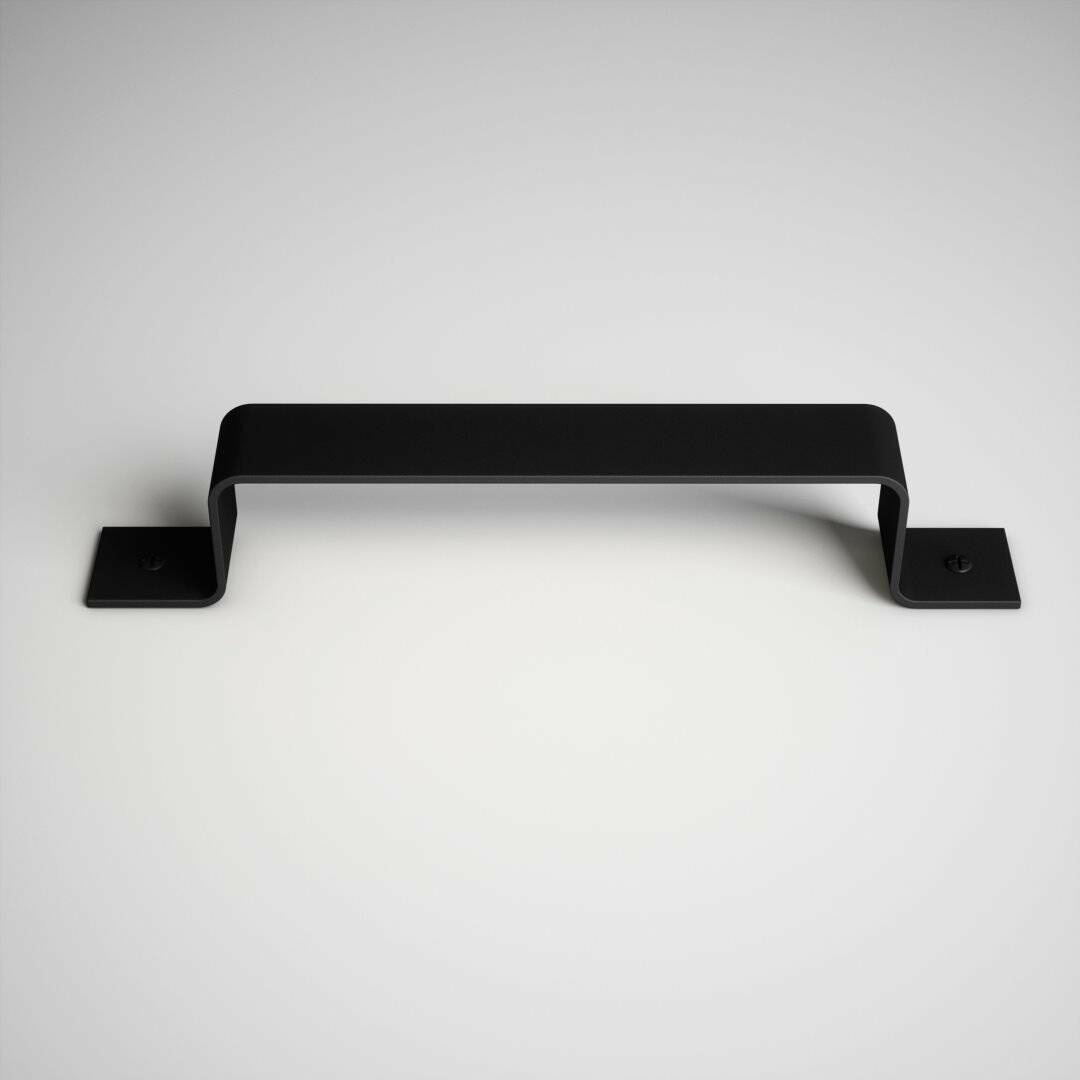 The 16th Street Barn Door Handle, with its minimalist black design, is mounted on a white surface and features two screws at each end for secure attachment.