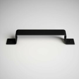 The 16th Street Barn Door Handle, with its minimalist black design, is mounted on a white surface and features two screws at each end for secure attachment.