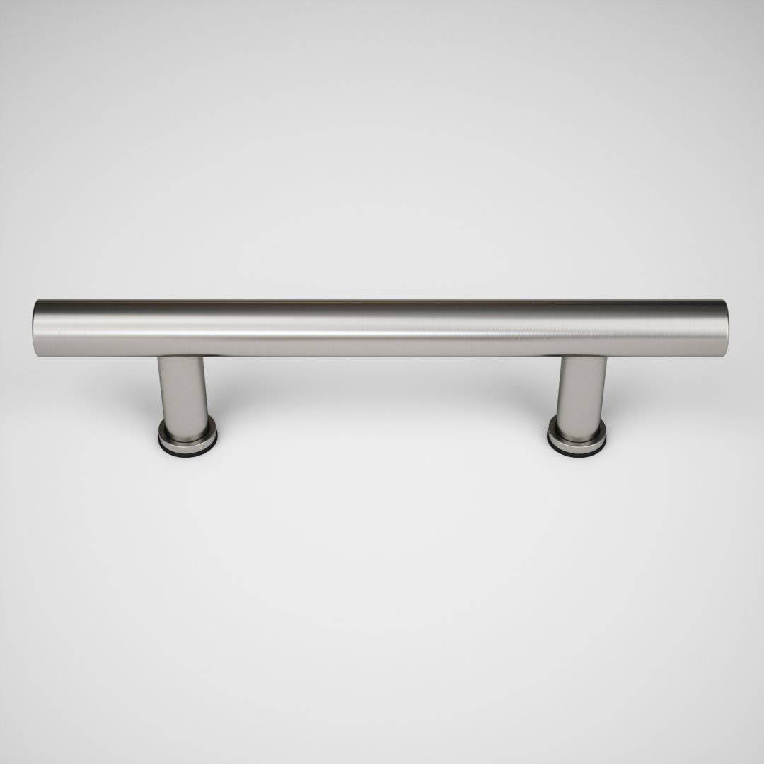 A stainless steel cylindrical handle with two mounting bases is centered against a plain white background, reminiscent of a sleek fixture you might find on a stylish barn door at 17th Street.