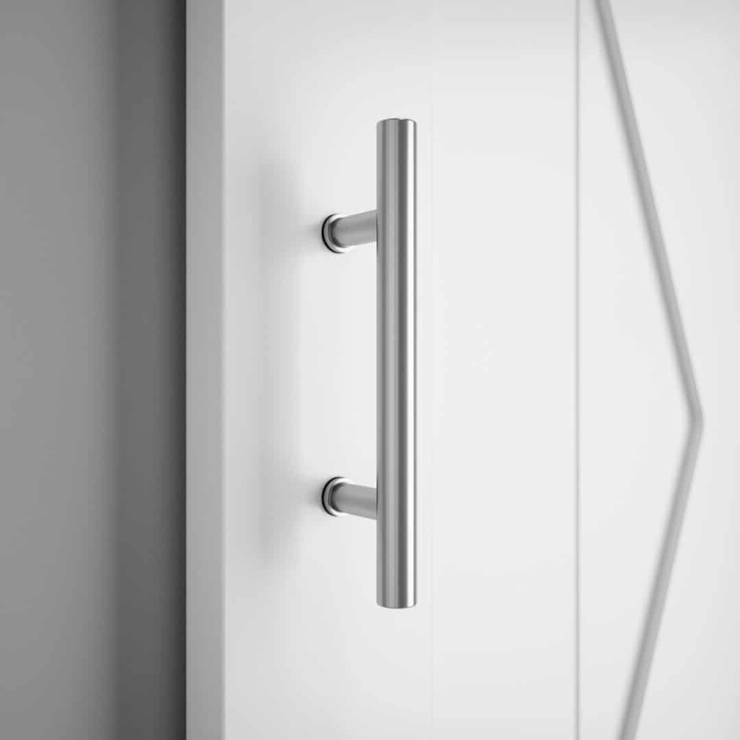 17 th street 12 door Close-up of the 17th Street Barn Door Handle, mounted on a white door. The modern silver design adds a touch of contemporary elegance to any space, reminiscent of the stylish finishes found on 17th Street.