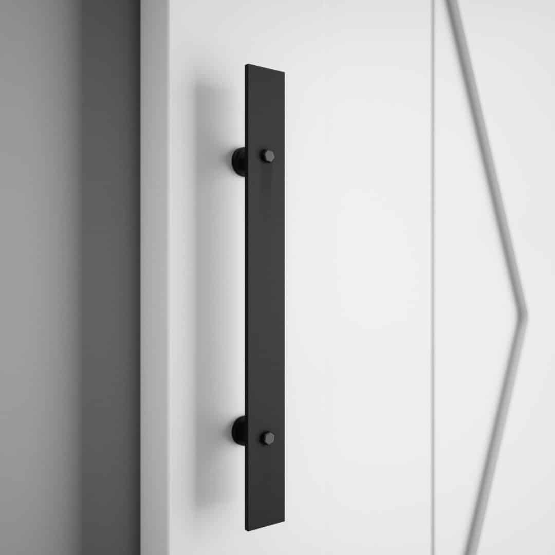 18 th street 16 DOOR A close-up of the 18th Street Barn Door Handle, finished in black and mounted on a white door adorned with geometric patterns.