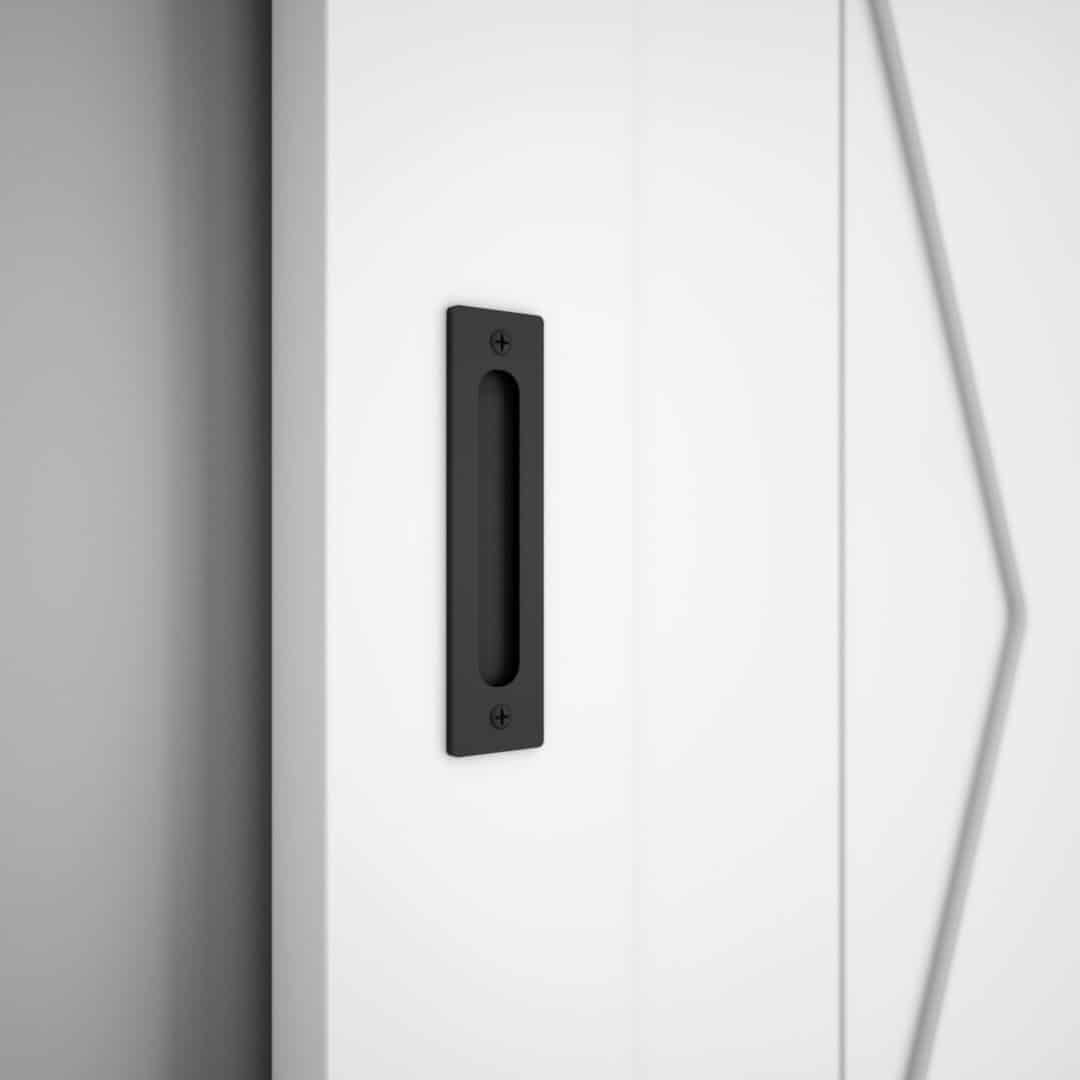 White door with a **19th Street Barn Door Handle 2 Sided**, featuring a black, rectangular recessed design.