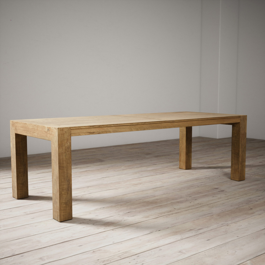 98 Villa Dining Table - Natural The Villa Dining Table - Natural, a simple and rectangular wooden table with a natural finish, stands on a light wood floor against a plain, white wall.