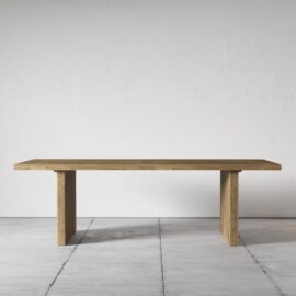 The Camden Dining Table, with its simple yet elegant rectangular design, sits gracefully on a tiled floor against a plain, white wall.