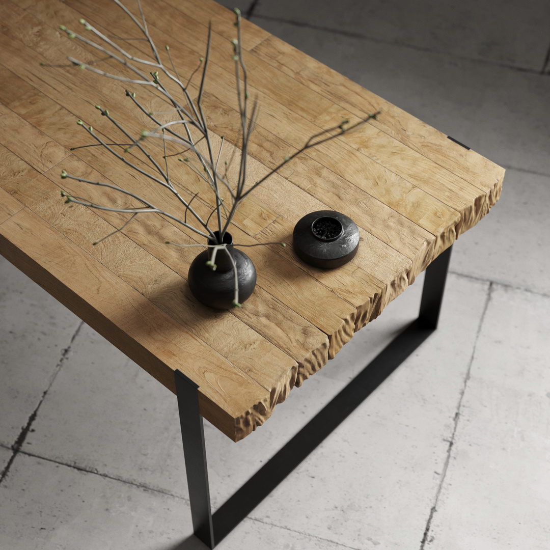 HUDSON DINING TABLE - 3 The Hudson Dining Table, a rectangular wooden piece featuring a raw edge, is beautifully adorned with a small branch in a black vase and complemented by a round black decorative item, all set atop a tiled floor.