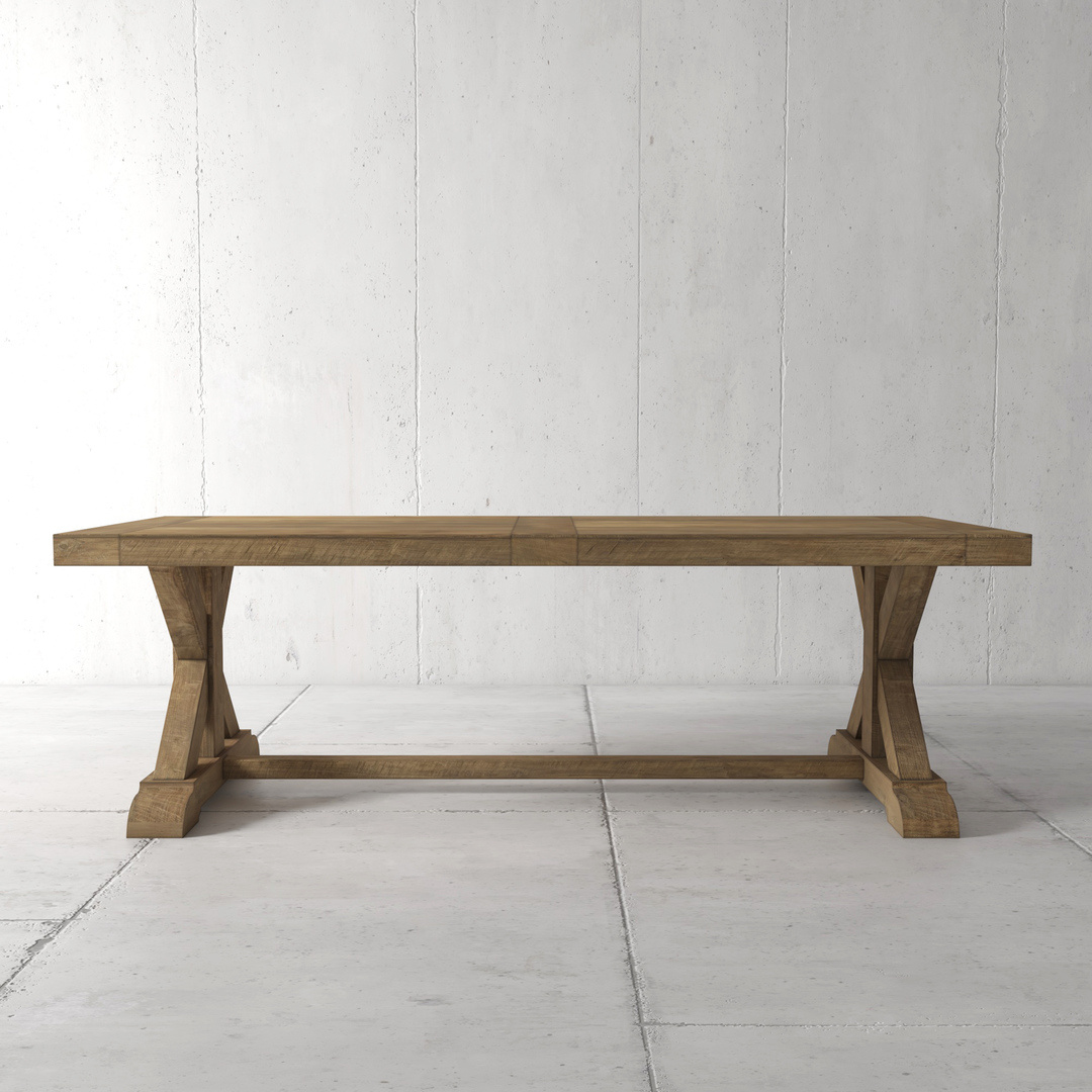 MADERA MAIN The Madera Dining Table - Natural, with its wooden rectangular tabletop and trestle base, stands on a tiled floor against a plain, white wall background.