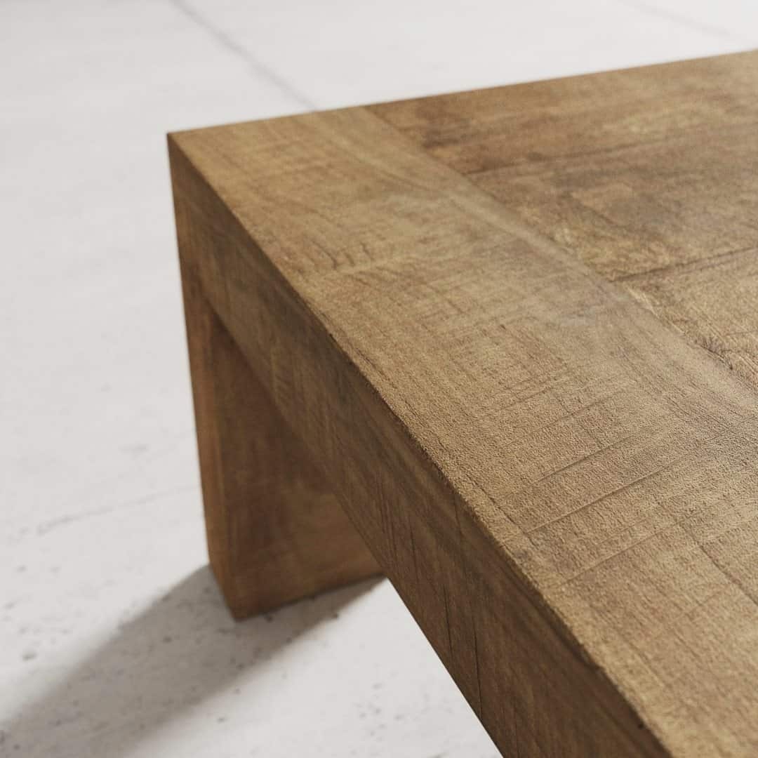 Urban Woodcraft 55 Madison Coffee Table - Natural (4) Close-up view of a corner of the Madison Coffee Table, showcasing its smooth-surfaced rectangular wooden design with a natural finish.