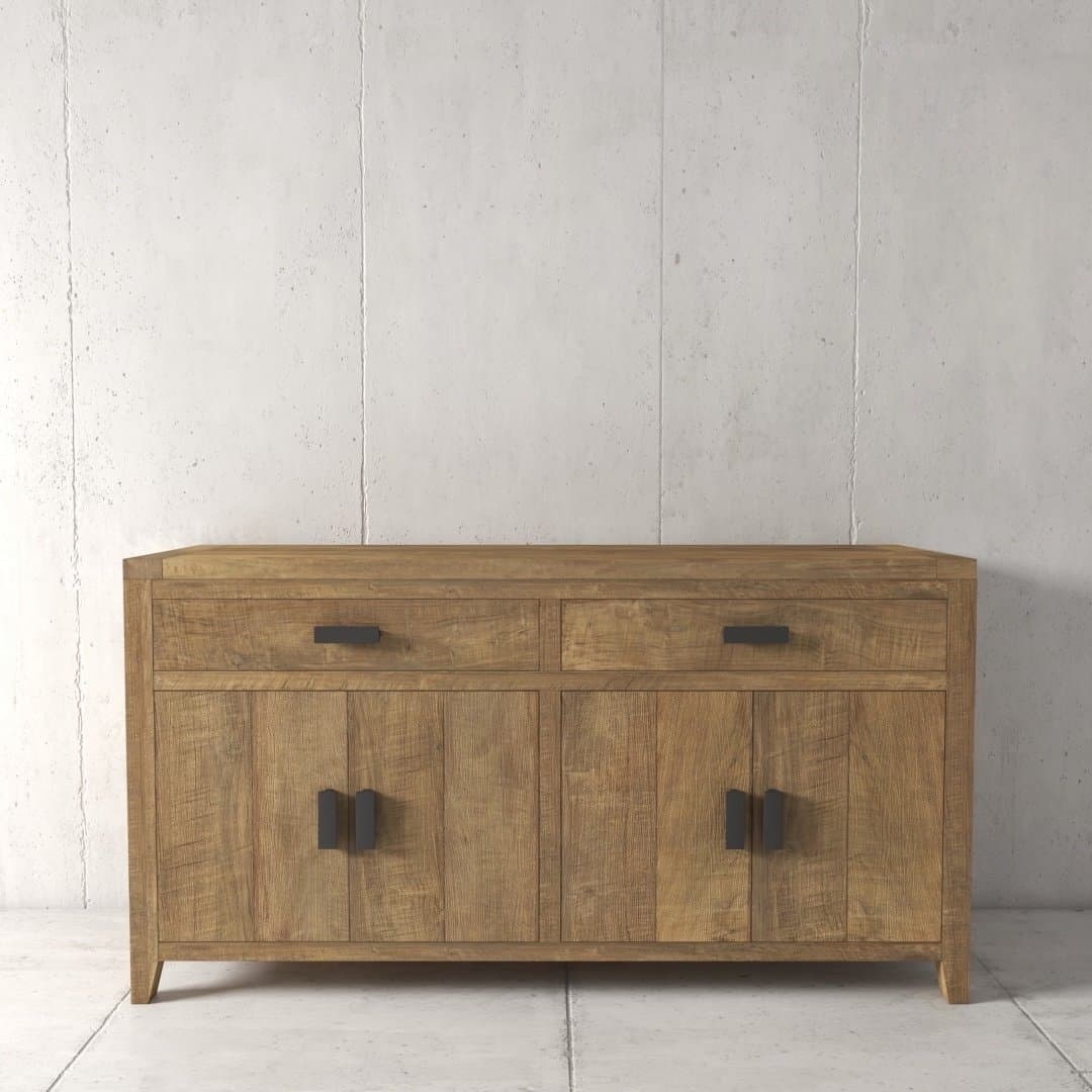 The Brookside Dining Buffet, a wooden sideboard with two drawers at the top and two cabinets below, featuring black metal handles, is set against a plain concrete wall.