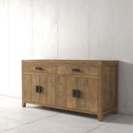 The Brookside Dining Buffet, a wooden sideboard with a natural finish, features two pull-out drawers on top and four cabinet doors below, each adorned with black handles. It is positioned against a plain concrete wall.