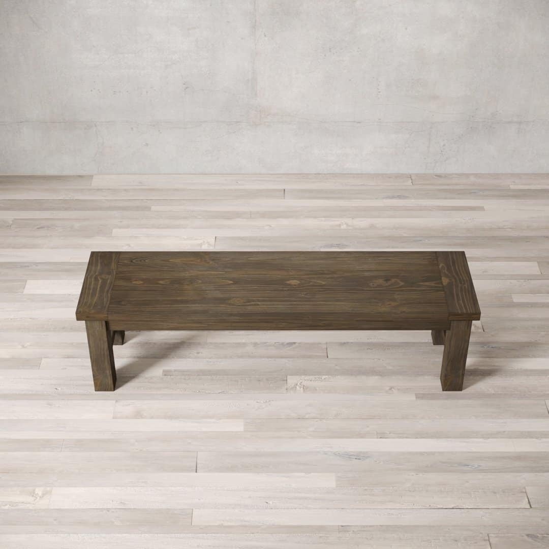 Urban Woodcraft 70 Squre Bench - Salvaged Espresso (4) A Square Dining Bench on a light-colored wooden floor with a textured, neutral-toned wall in the background.