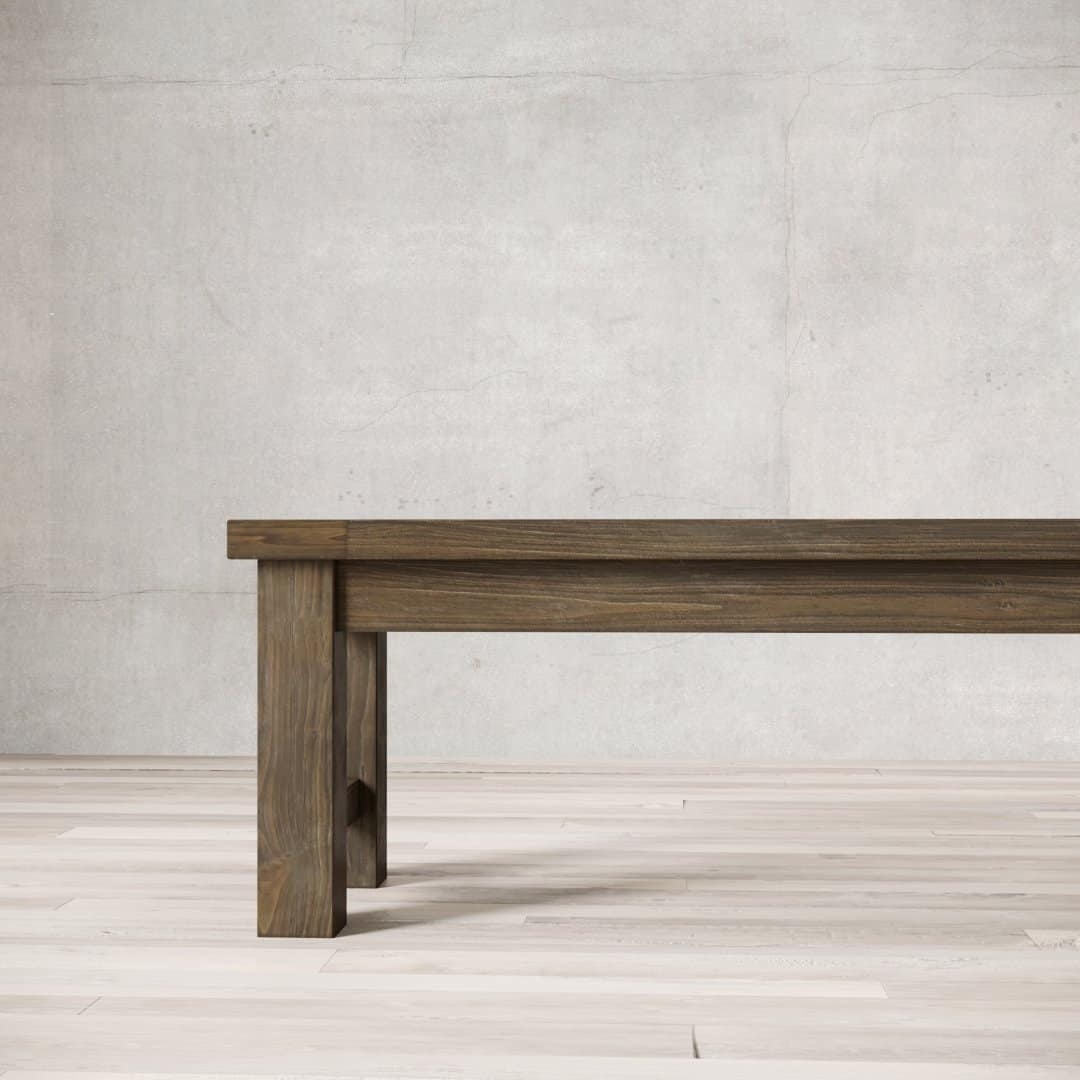 Urban Woodcraft 70 Squre Bench - Salvaged Espresso (5) A Square Dining Bench with straight legs placed against a plain concrete wall background.