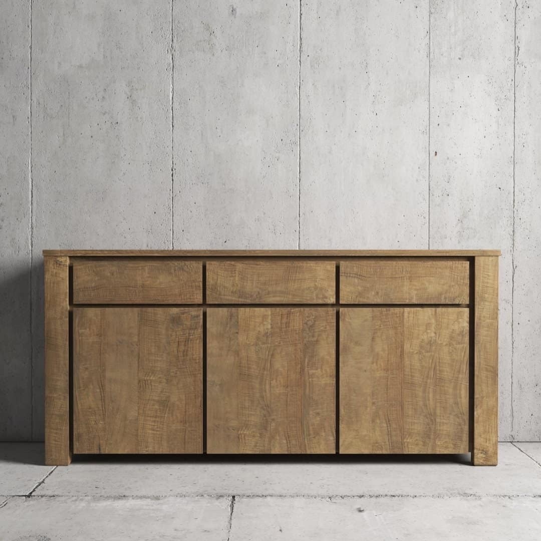 The Teca Dining Buffet with three drawers and two cabinet doors stands against a bare concrete wall.