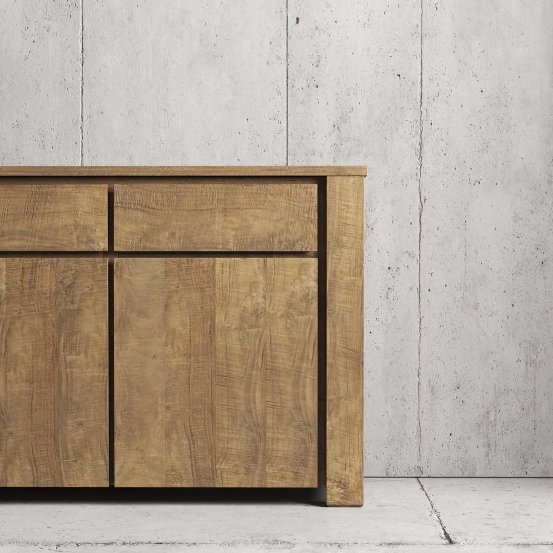 Urban Woodcraft 75 Teca Dining Buffet - Natural (4) The Teca Dining Buffet, featuring three drawers and two cabinets, stands against a bare concrete wall.