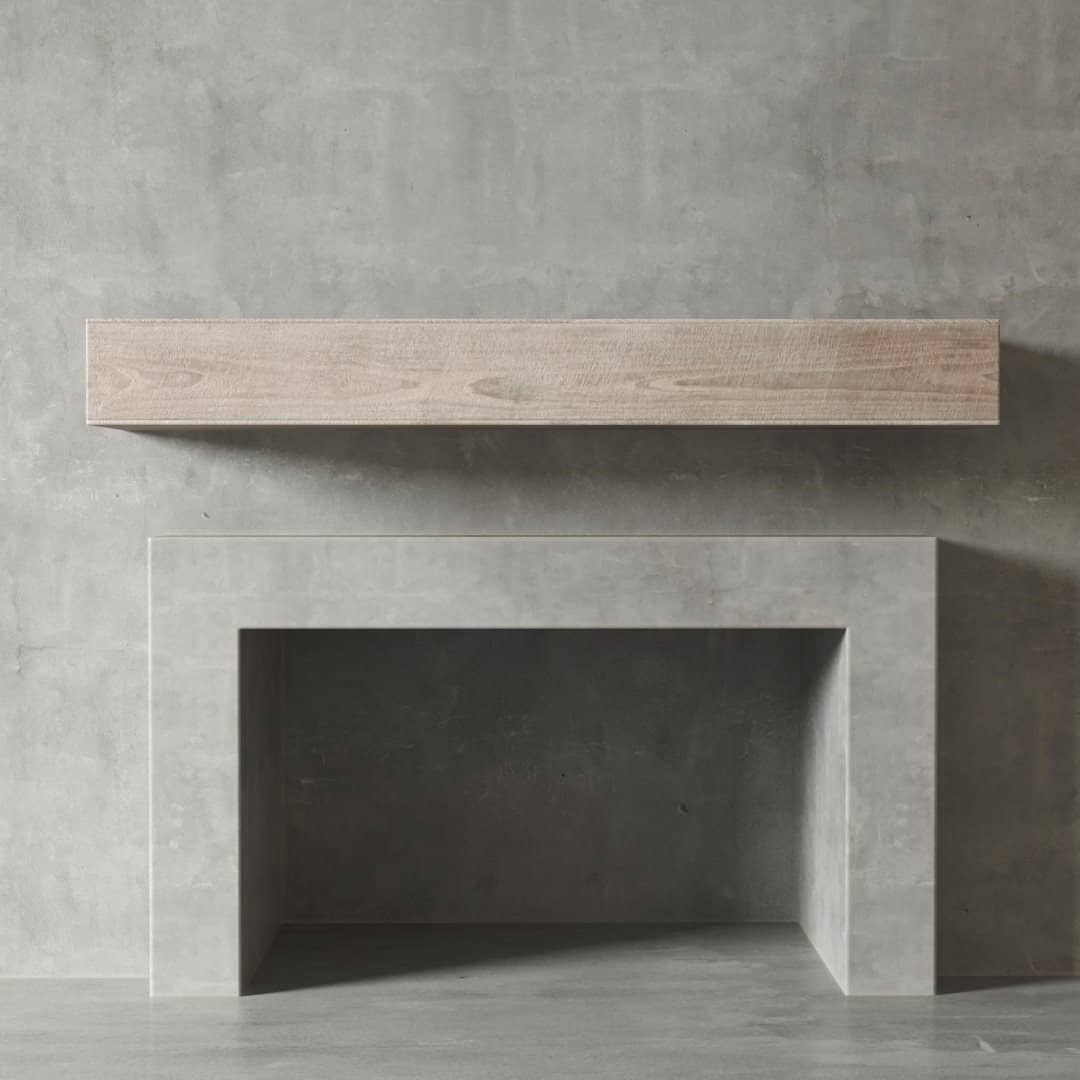 Urban Woodcraft Duluth Wall Mantel – White Wash (1) A minimalist concrete textured wall in Duluth features a floating wooden mantel above an empty modern concrete fireplace.