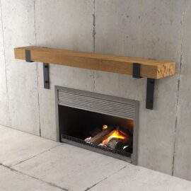 Hudson Wall Mantel featuring a concrete surround, wooden mantel supported by metal brackets, and a lit fire below emitting a warm glow.