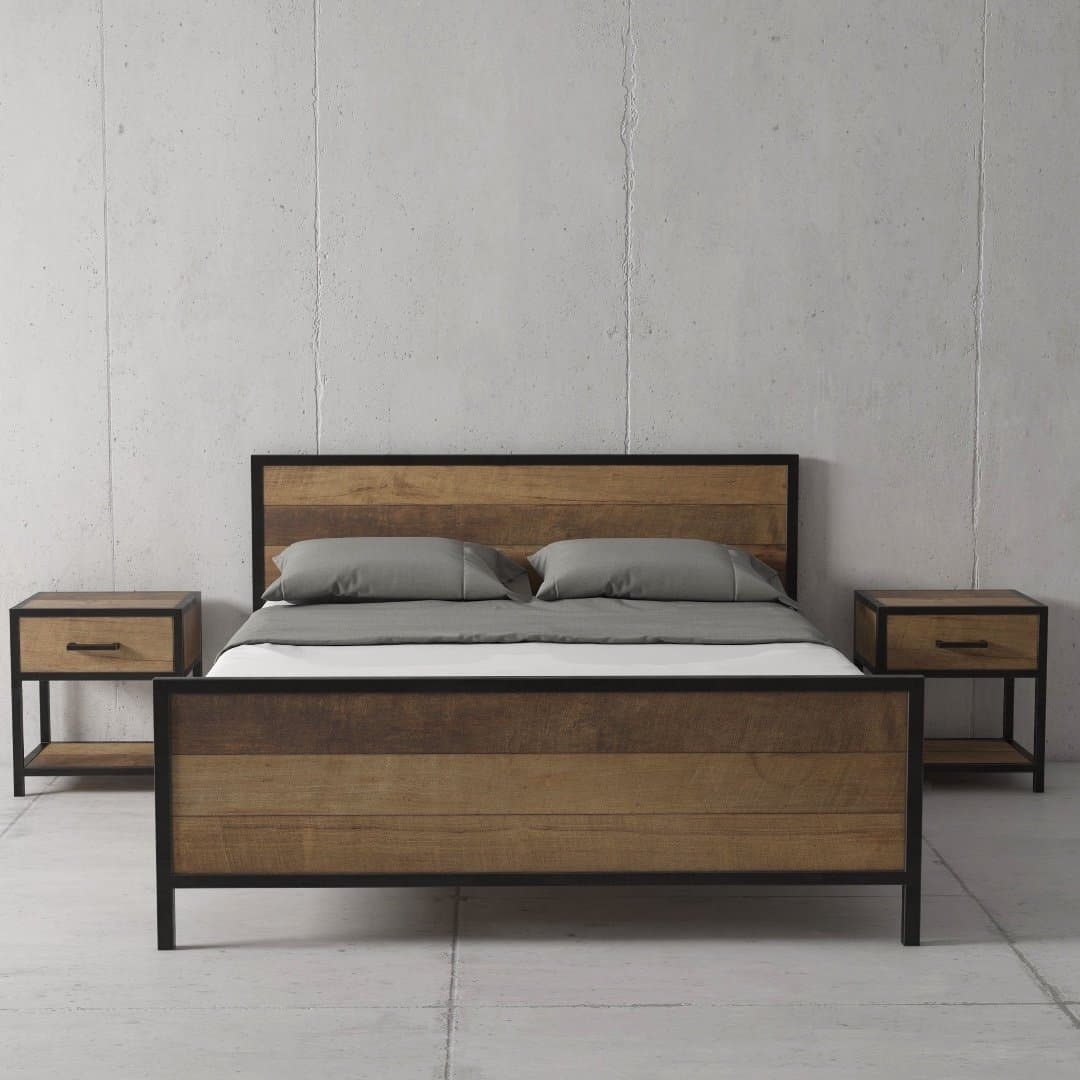The Opus Bed, a modern wooden model featuring both a headboard and footboard, stands between two matching bedside tables. The bedding includes two gray pillows and a gray sheet, while the walls and floor are concrete.