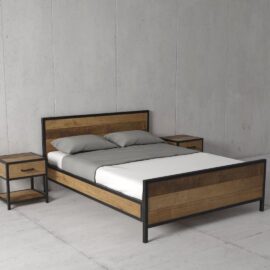 The Opus Bed is a stylish modern wooden bed with a sturdy metal frame, complemented by two grey pillows, a coordinating grey duvet, and paired with two matching wooden nightstands against a sleek plain grey wall.