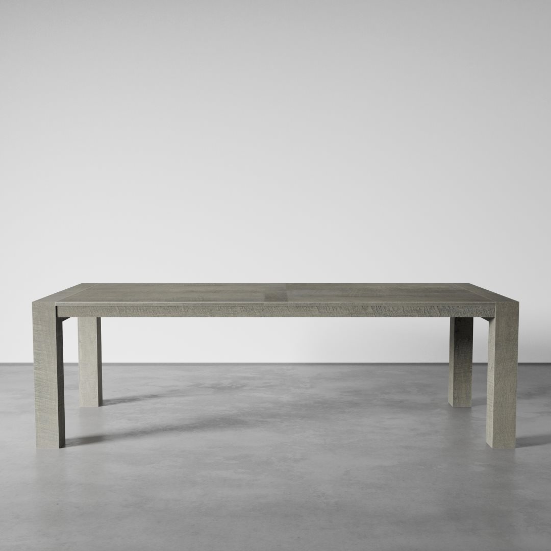 A Villa Dining Table - Natural stands on a smooth, gray concrete floor within a minimalist setting.