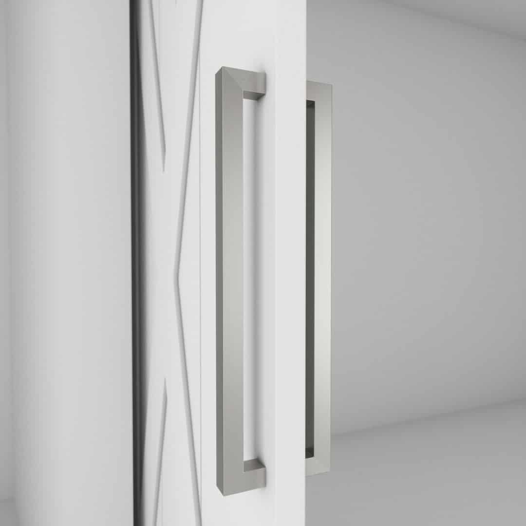 master 2 A close-up image of the door hardware features the 21st Street Door Handle, a sleek silver rectangular design, mounted on a white door that is partly open, revealing an empty light gray interior space.