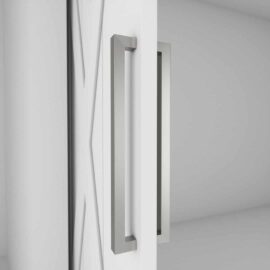 A close-up image of the door hardware features the 21st Street Door Handle, a sleek silver rectangular design, mounted on a white door that is partly open, revealing an empty light gray interior space.