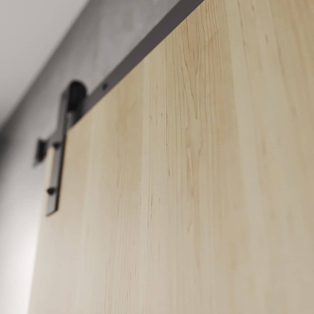 ADDITIONAL (IMAGE 2) FL.MV - Flushed Maple Vaneer DOF A close-up view of the upper portion of the Nordic 83" x 40" Barn Door, highlighting the metal track and hardware attached to a gray wall.