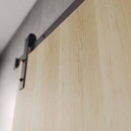 A close-up view of the upper portion of the Nordic 83" x 40" Barn Door, highlighting the metal track and hardware attached to a gray wall.