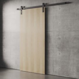 The Nordic 83" x 40" Barn Door, featuring wooden construction and metal hardware, is mounted on a gray concrete wall.