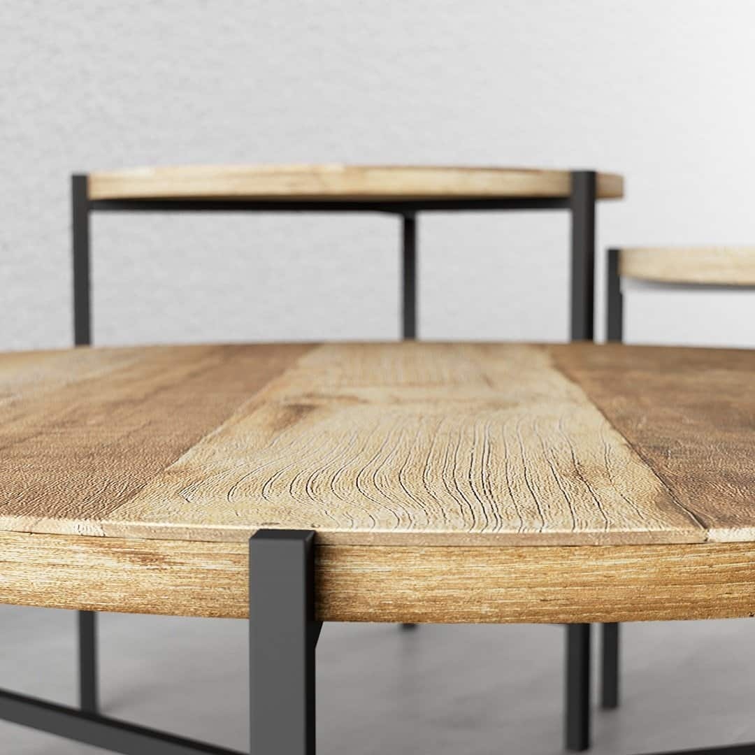 KL 007 doof 2 Close-up of two pieces from the 3-Piece Round Coffee Table with Star Legs set, showcasing the intricate wood texture and contemporary design. The tables are positioned on a light gray surface against a matching backdrop.