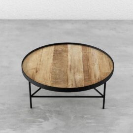 Round Coffee Table featuring a wooden top and black metal frame and legs, set against a concrete floor background.