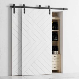 The Single Track By-Pass white sliding barn doors partially cover a pantry with shelves storing bottles and drawers.