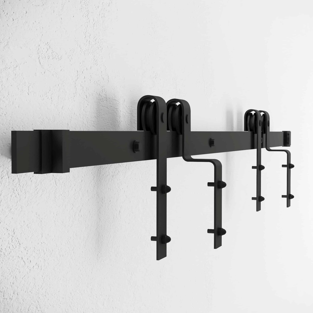 A Single Track By-Pass black metal sliding barn door hardware kit mounted on a white wall.