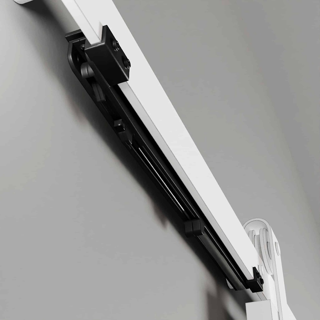 Close-up view of the Soft Close unit, a white wall-mounted retractable device with a sleek black sliding mechanism.