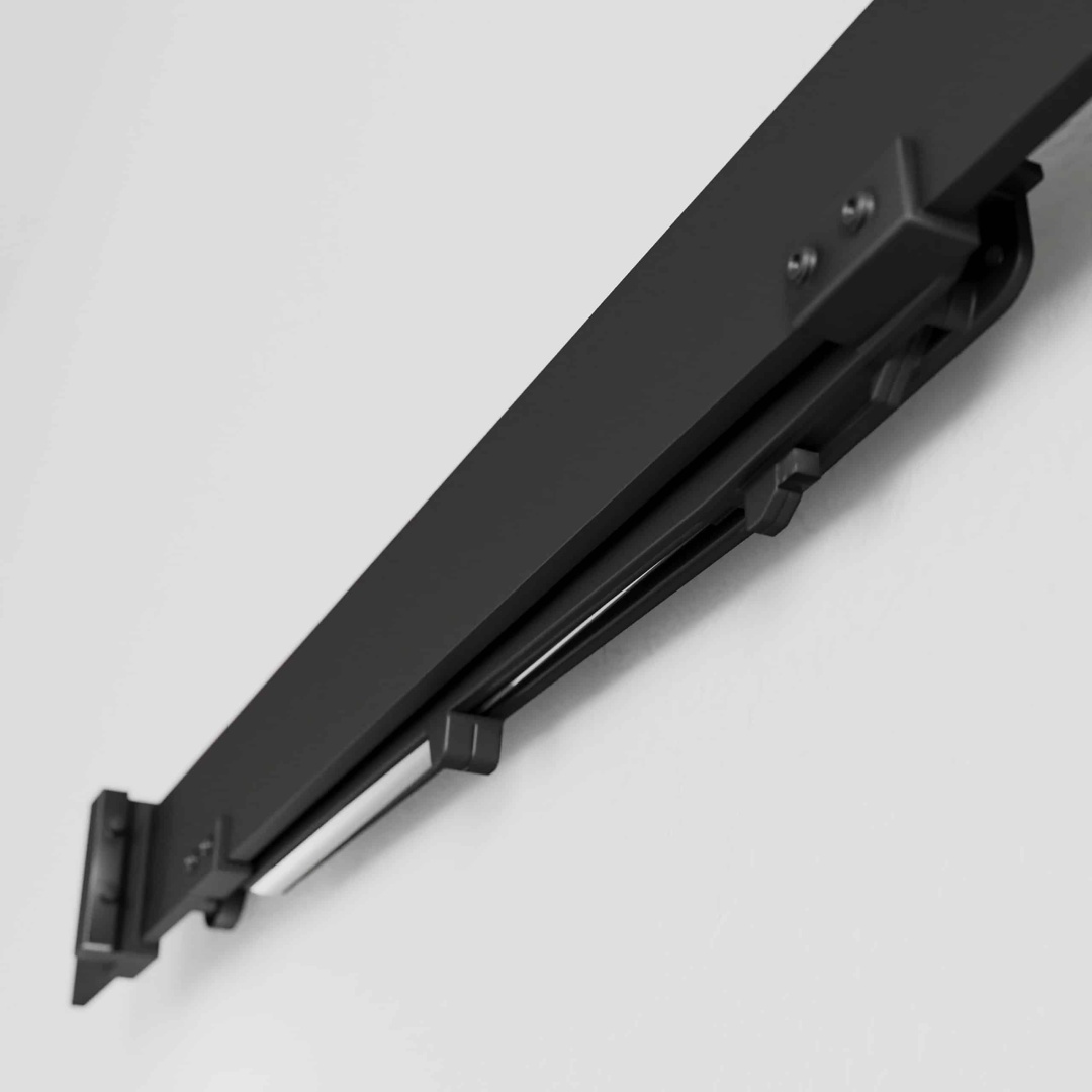 Close-up of the Soft Close black sliding door track mounted on a white wall, showcasing its metal components and screws.