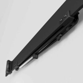 Close-up of the Soft Close black sliding door track mounted on a white wall, showcasing its metal components and screws.