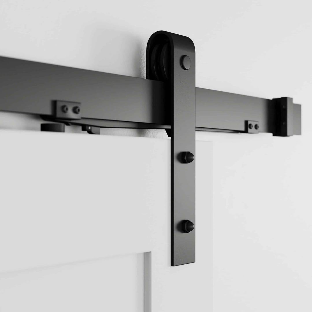 Soft Close 3 Close-up of the Soft Close black sliding barn door hardware installed on a white door, showcasing the roller mechanism and track.