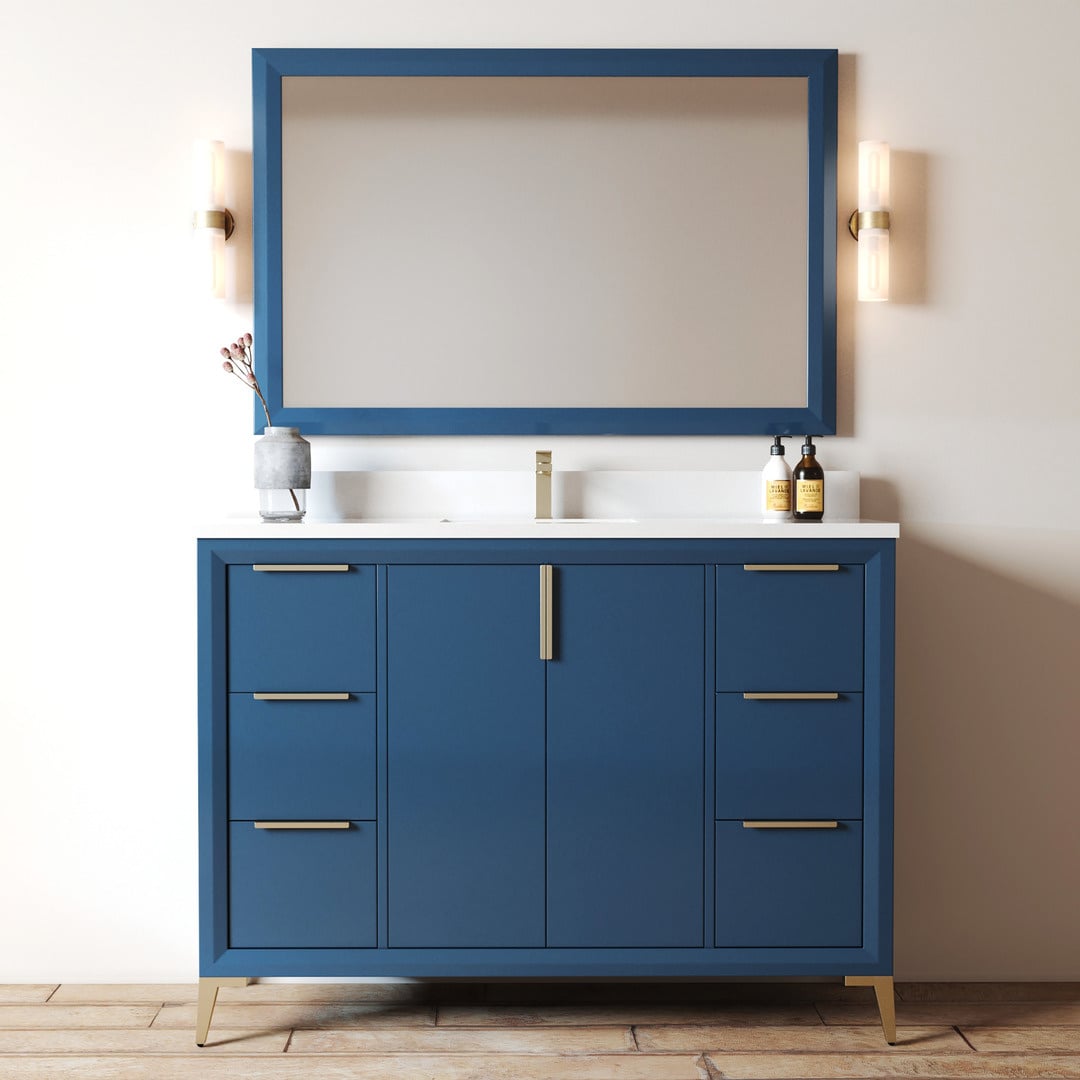 The Mendocino 48" Single Sink Bathroom Vanity features a modern blue cabinet, a pristine white countertop, a large rectangular mirror, two elegant wall-mounted lights, and stylish decorative items on the counter.
