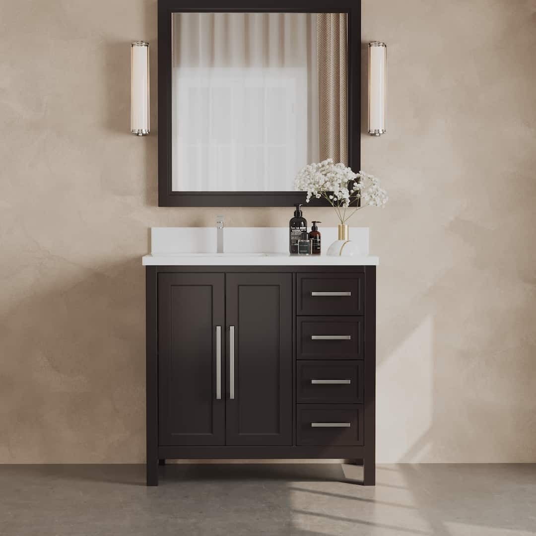 A bathroom featuring the Acadian 36" Single Sink Bathroom Vanity in dark wood, complemented by a pristine white countertop, a large mirror, dual lights, a sleek faucet, and an arrangement of white decorative flowers in a vase.