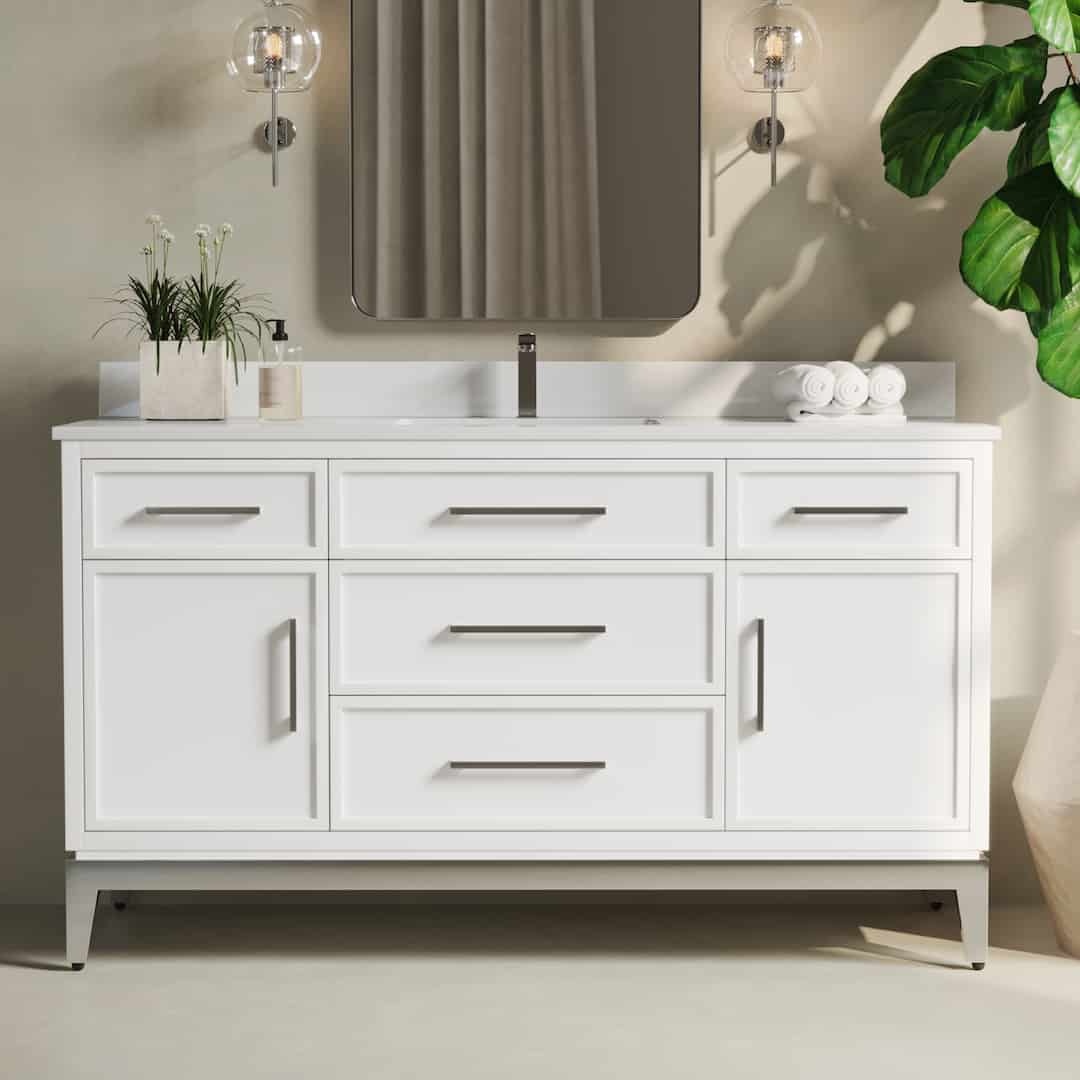A Barrington 60" Single Sink Bathroom Vanity in white, featuring six drawers and two cabinet doors, complemented by a rectangular mirror above it and a plant positioned to the left.