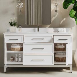 The Barrington 60" Single Sink Bathroom Vanity features a modern white design with a large mirror, drawers, and open shelves. It is adorned with plants, soap dispensers, and rolled towels.