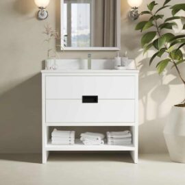 The Delamere 36" Single Sink Bathroom Vanity, in white, is accompanied by a mirror above it and includes two drawers and an open shelf perfect for holding neatly folded white towels. To the right, a potted plant adds a touch of greenery.