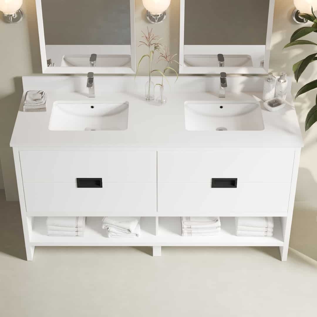 Urban Woodcraft Delamere 63in Double Bathroom Vanity White 3 A tidy Delamere 63" single sink bathroom vanity with white countertops and cabinets, neatly organized towels, soap dispensers, and a potted plant, under two mirrors and light fixtures.