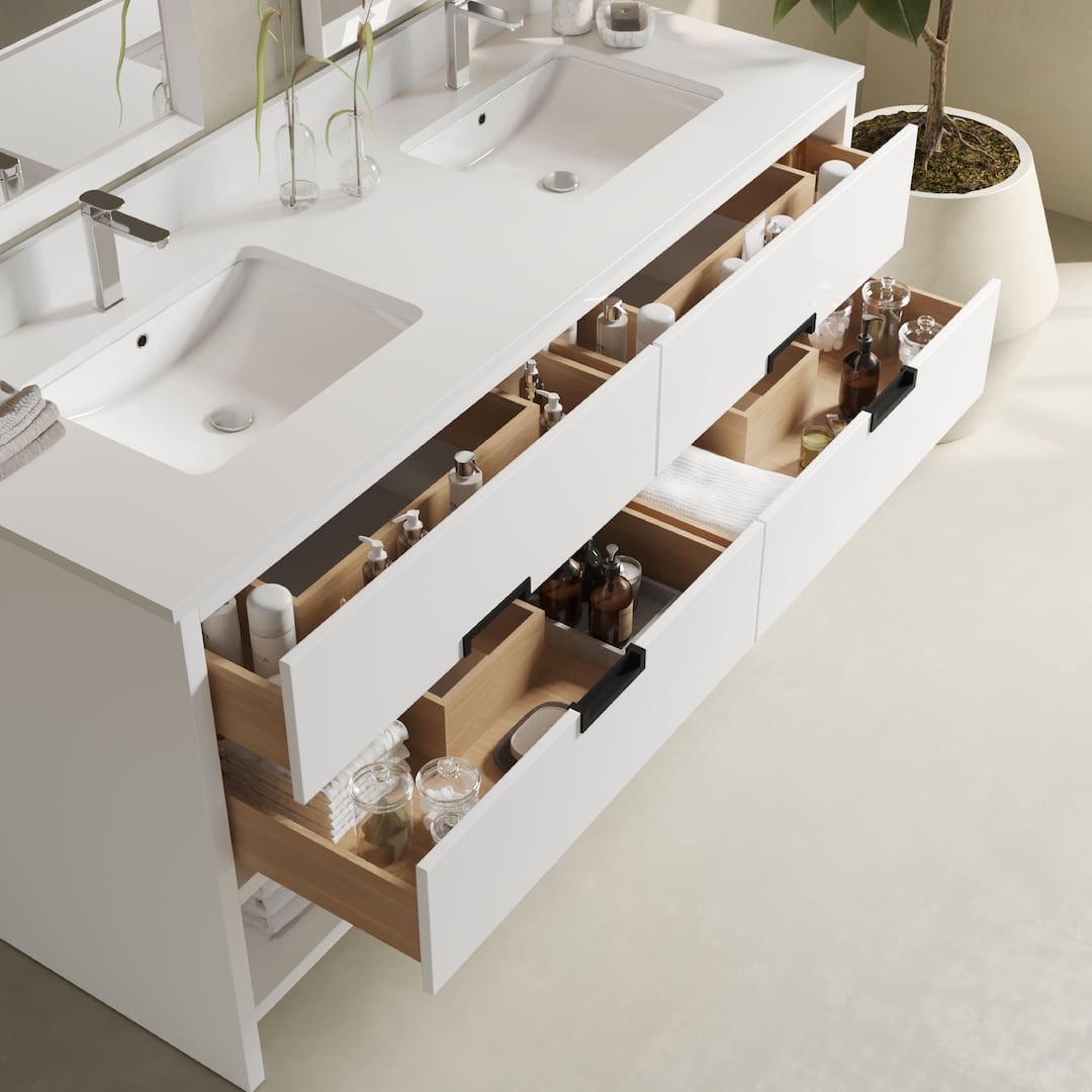 Urban Woodcraft Delamere 63in Double Bathroom Vanity White 4 The Delamere 63" Single Sink Bathroom Vanity features open drawers that are neatly organized with various toiletries, bottles, and containers. A large potted plant is placed nearby for a touch of greenery.