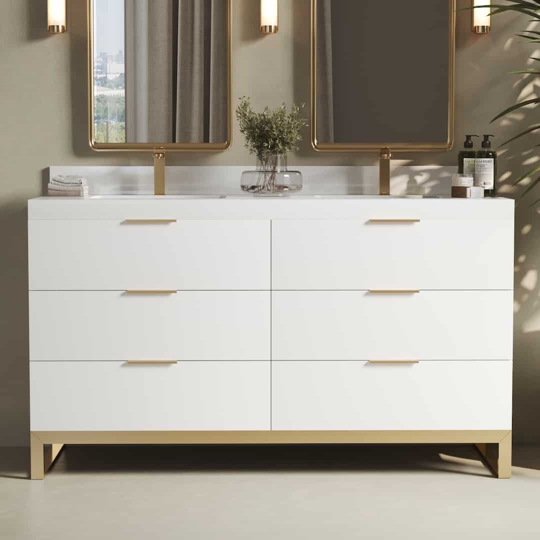 The Haldon 60" Double Sink Bathroom Vanity features a modern white design with six drawers, a pristine white countertop, and two mirrors above it, adorned with a plant and various toiletries.
