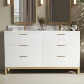 The Haldon 60" Double Sink Bathroom Vanity features a modern white design with six drawers, a pristine white countertop, and two mirrors above it, adorned with a plant and various toiletries.