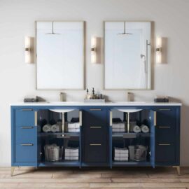 The Mendocino 72" Double Sink Bathroom Vanity showcases blue cabinetry with open doors that provide storage space for towels and baskets. Above the sinks, two mirrors and wall-mounted light fixtures are installed.