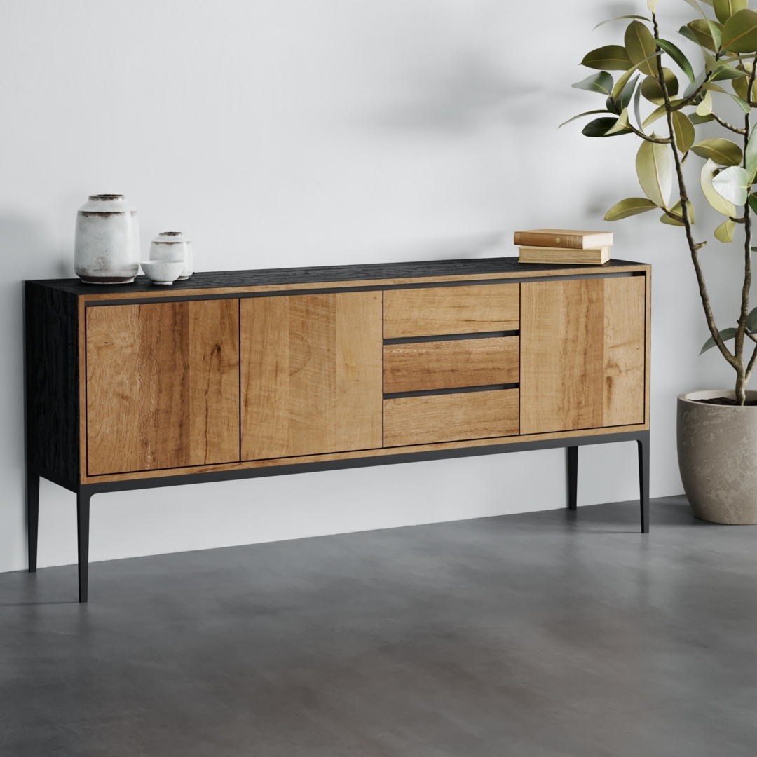 The Kolt 3 Door Dining Buffet, a modern wooden sideboard with a black top and base, featuring two cabinets and three drawers, stands on a grey floor next to a potted plant and two ceramic vases.