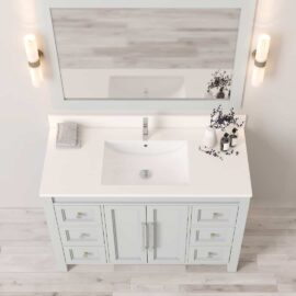 The Belluno 48" Single Sink Vanity in white features a large mirror and two wall-mounted lights. The vanity includes multiple drawers and a white countertop with an integrated sink, adorned with a towel and decorative items on the surface.