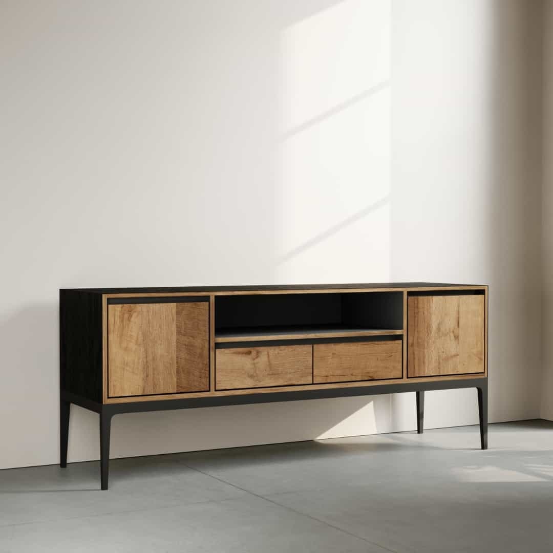 60 KOLT WIDE TV STAND - 2 The Kolt 60" Wide TV Stand, featuring a modern wooden design with black accents, two cabinets, two drawers, and an open shelf, is set against a light-colored wall with a shadow falling across it.